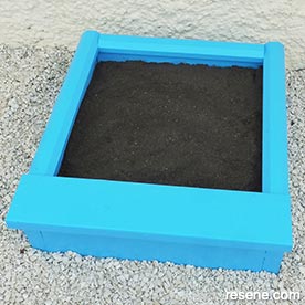 Build a mini sandpit for your children
