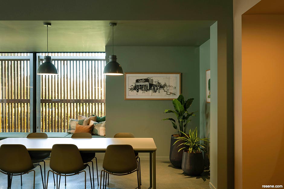 A cool green and warm gold office interior