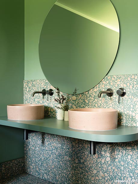 A green and gold bathroom