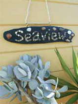 Make driftwood into a house plaque