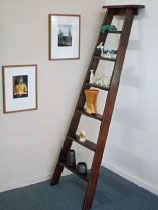 Transform an old wooden ladder into a funky shelf