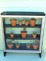 Make a mini glasshouse from a window and fene palings