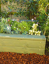Make a raised bed planter with built in seat