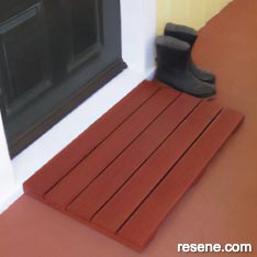An all-weather doormat
using grooved decking