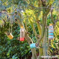 Upcycle containers and jars to make bird feeders for your garden