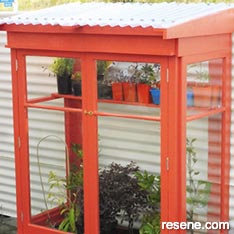 Build a glasshouse from recycled materials