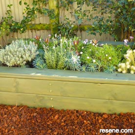 Raised bed with seat