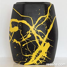 Paint this stylish two-tone splatter vase