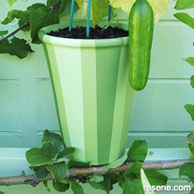 Paint a terracotta pot in shades of green