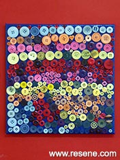 Make an artwork from colourfull buttons.