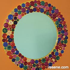 A multi-coloured mirror frame 