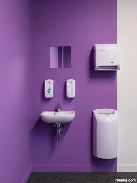 A purple handwashing station