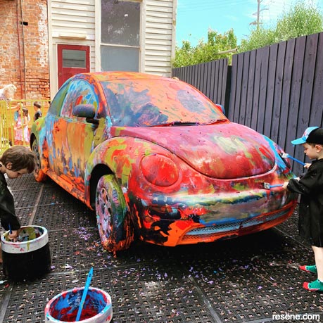 Kids paint donated cars