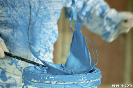 Splattering blue paint