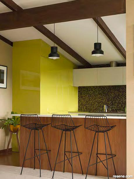 A bold yellow mid-century kitchen in Resene Tweet