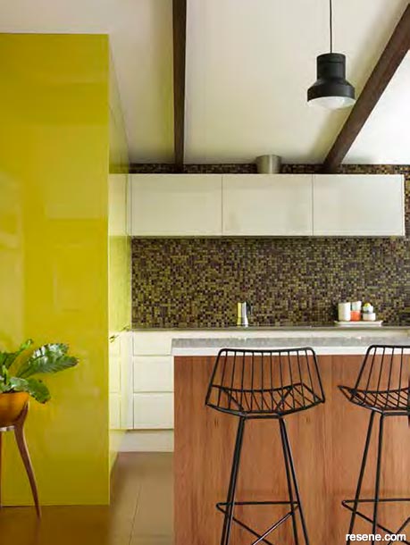 A bold kitchen with retro gold tiles