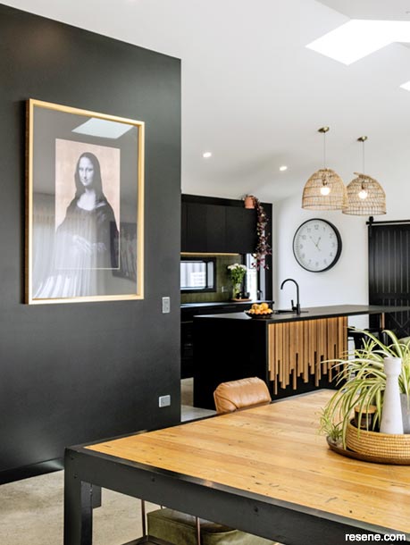 Resene Black is striking in the kitchen, feature wall and doors.