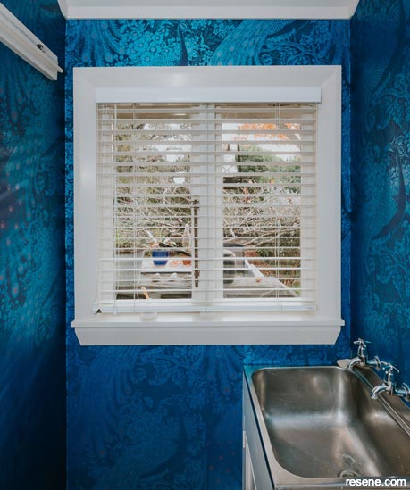 A bold and glamourous blue bathroom and laundry