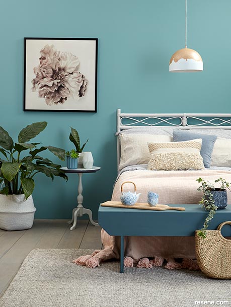 A calming blue-green bedroom