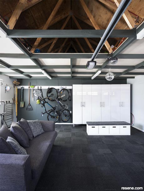 A garage with a loft style ceiling for extra storage