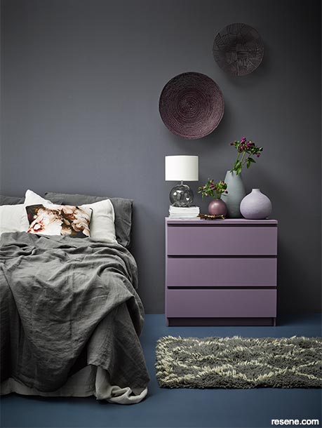 A dark room with lilac accents