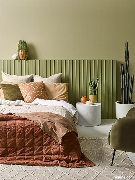A texture-rich green master bedroom