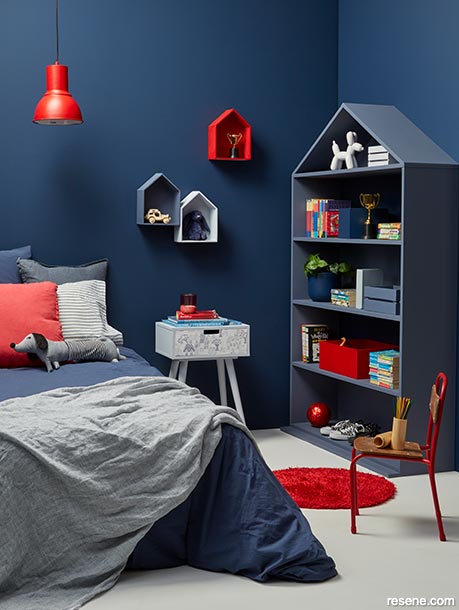 A blue child's bedroom with red accents