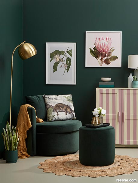 A dark green lounge with emerald and rose accents