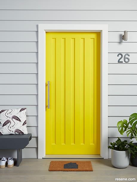 A bold yellow  front door adds street appeal