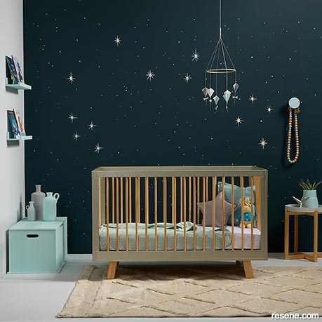 A nursery with a starry night mural