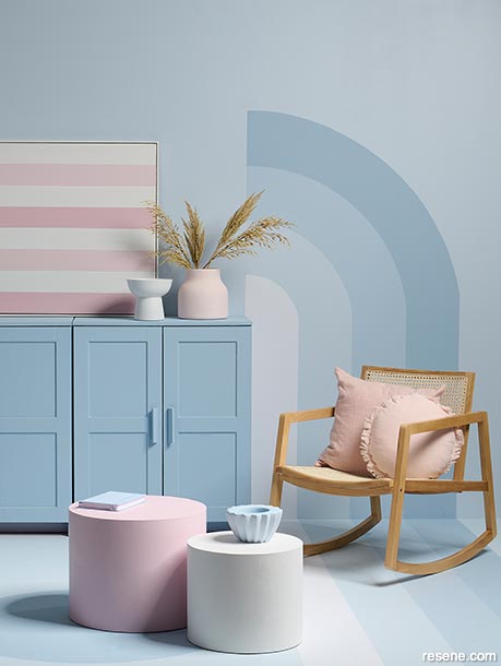 A sugary pastel interior with a wall mural 