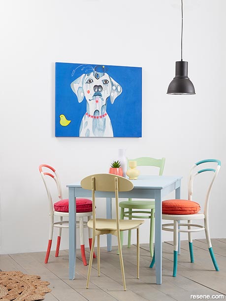 A simple dining room with pops of colour