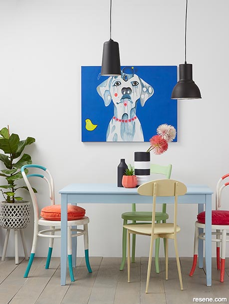A dining room with bold pops of colour