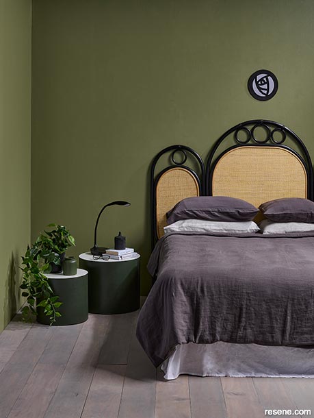 A sage and olive green art nouveau bedroom