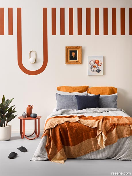 A bedroom with warm brown stripes
