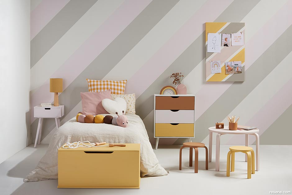A kids bedroom with diagonal stripes