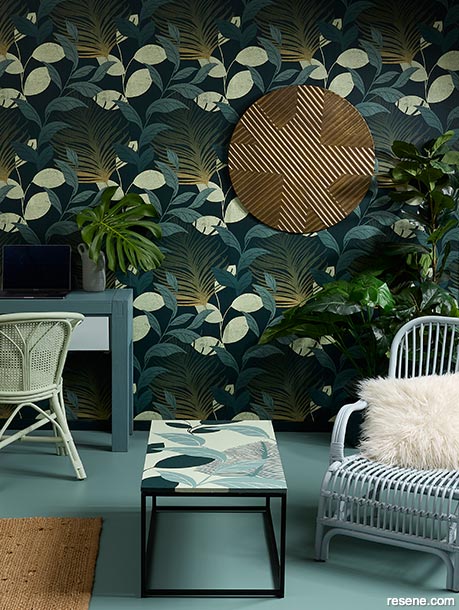 A living area with dramatic and botanical wallpaper