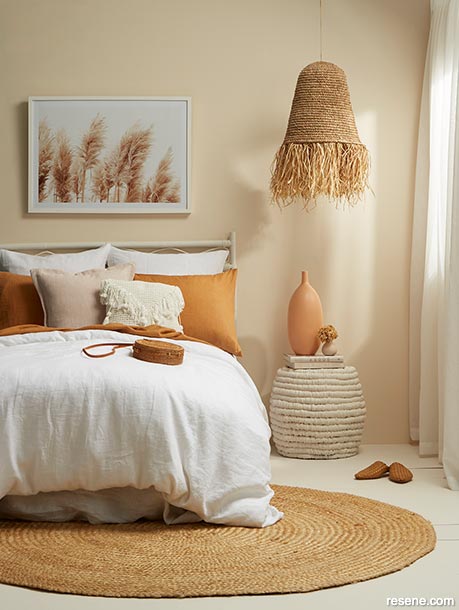A bedroom painted in warm neutral hues
