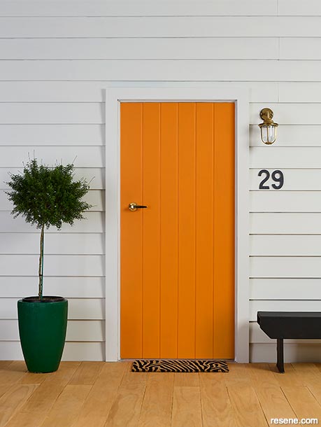 A bright orange front door