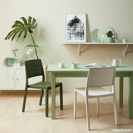 A neutral kitchen/dining room with green accents