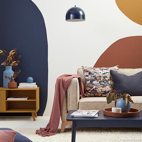 A bright white wall is used to accentuate bold coloured shapes
