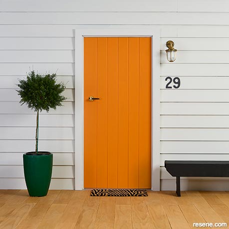 A bright orange front door
