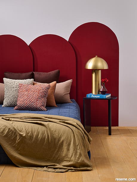 A luxury ruby red panelled headboard