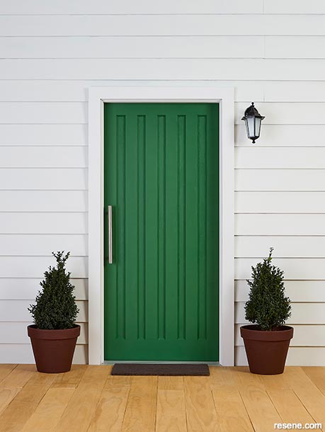 A deep green front door
