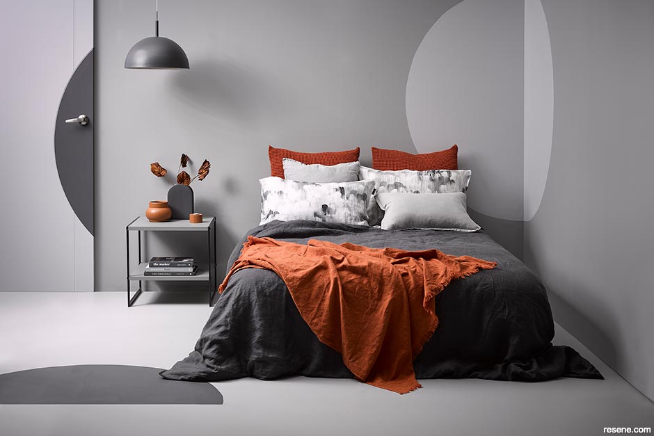 A bedroom with layers of different shades of grey
