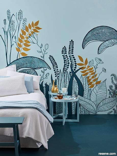 A bedroom with nature inspired artwork