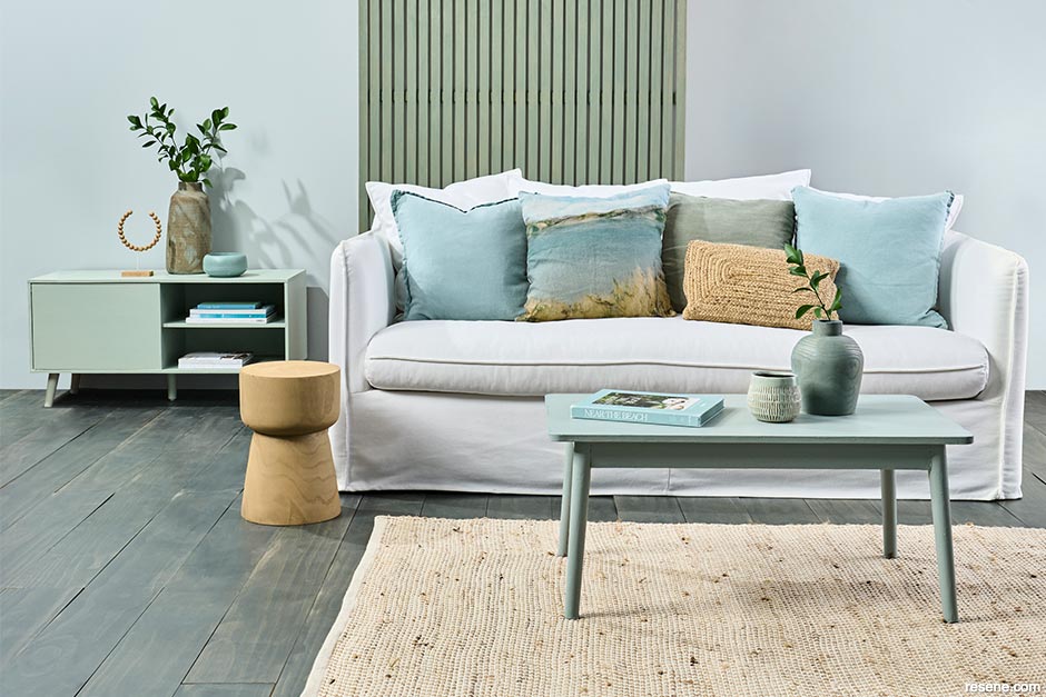 A lounge painted in nature inspired blues and greens