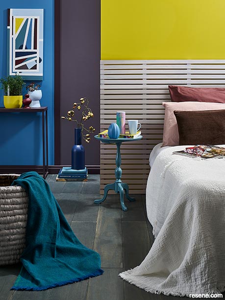 A bedroom with bold and unexpected colour combinations