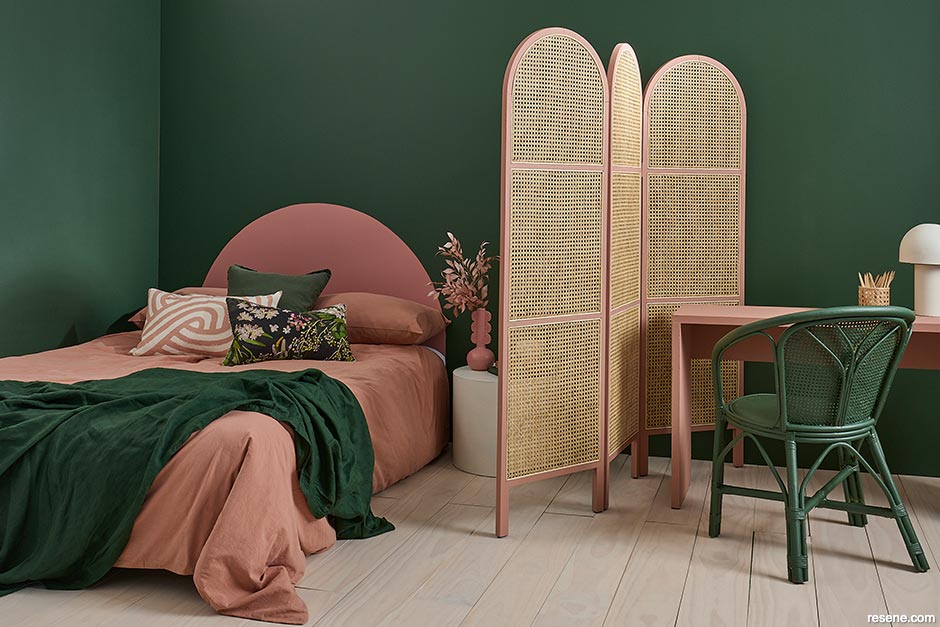 A dark green and pink bedroom