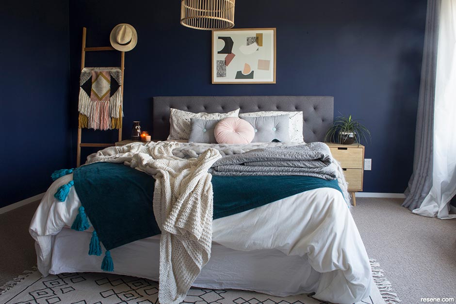 An inky blue bedroom